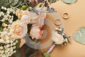 Wedding bouquet and gold rings, closeup