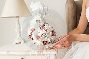 Wedding bouquet in hands of beautiful bride. Wedding concept.