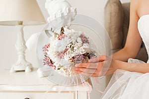 Wedding bouquet in hands of beautiful bride. Wedding concept.