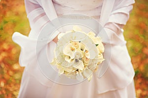 Wedding bouquet in hands of the bride