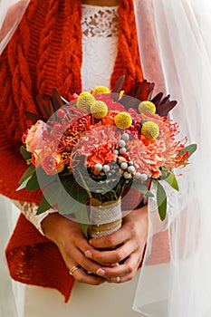 wedding bouquet in the hands of the bride