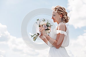 Wedding bouquet in hands of the bride