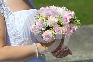 Wedding bouquet in hands of bride