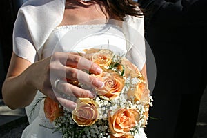 Wedding bouquet in the hands of the bride