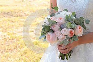 Wedding bouquet in hands of bride