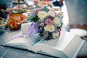 Wedding bouquet on the Koran