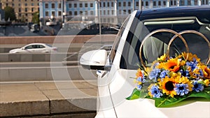 Wedding bouquet lies on the car. Beautiful bouquet by car . Wedding day. Summer Day. Flowers