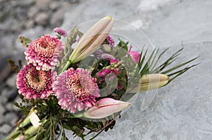 Wedding bouquet. The most important bouquet at the wedding is the bride`s bouquet. A bouquet of flowers lies on ice