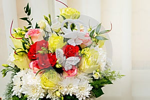 Wedding bouquet of multicolored roses and chamomile. Flowers for