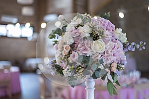 Wedding bouquet of pink and lilac peonies and roses.