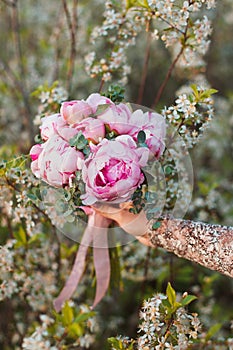 Wedding bouquet of pink peonies