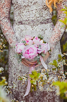 Wedding bouquet of pink peonies