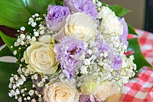 Wedding bouquet resting on the bench