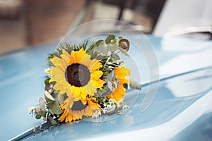 Wedding bouquet on a retro car