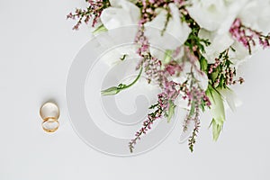 Wedding bouquet and rings. Marriage and love concept. Flat lay