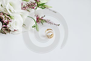 Wedding bouquet and rings. Marriage and love concept. Flat lay