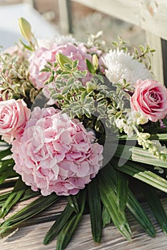 Wedding bouquet with rose bush, Ranunculus asiaticus as a background