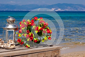 Wedding bouquet of roses on the beach