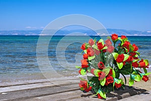 Wedding bouquet of roses on the beach