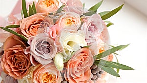 Wedding bouquet of roses. Bride`s bouquet on wedding day. Bouquet of different flowers. Bouquet of beautiful pink and