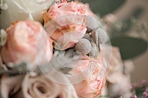 Wedding bouquet in shades of dusty rose, white, green, beige, pink and purple. Beautiful and delicate bridal bouquet close up with