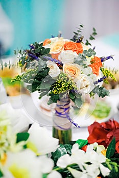Wedding bouquet on a table at banquet.