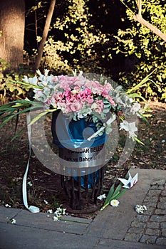 Wedding bouquet thrown in a garbage can