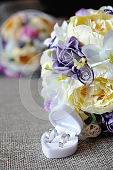 Wedding bouquet with two golden rings