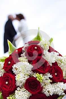 Wedding bouquet with wedding couple