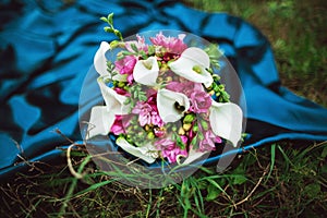 Wedding bouquet of white calla lilly flowers and pink roses