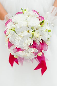Wedding bouquet with white flowers in hands