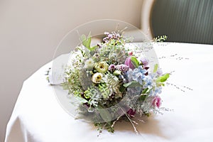 Wedding bouquet of wild flowers on table