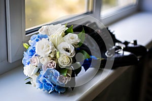 Wedding bouquet by the window.the attributes of the groom. newly married couple. the preparations of the groom