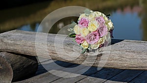 Wedding bouquet on a wooden board