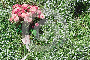 Wedding bouquets of biege carnations and pink roses