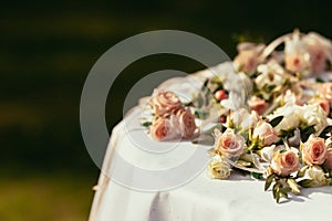 Wedding boutonnieres for quests on table with place for sign