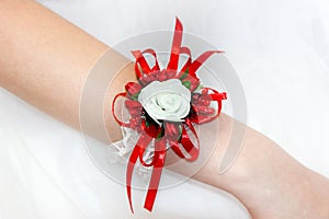Wedding bracelet of satin ribbon on the hand of the bride