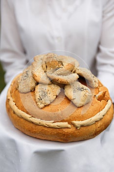 Wedding bread from wheat flour dough decorated with flowers