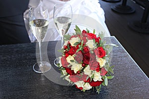Wedding bridal bouquet and 2 glasses of champagne