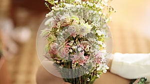 Wedding bridal bouquet of Gypsophila in the hands of the bride.