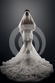 Wedding Bride Back Rear View, Beautiful Woman in Elegant Sexy Dress with Long Tail Train and Veil, Studio Portrait