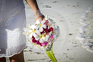 Wedding bride with tropical flowers bouquet