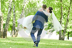 Wedding. bridegroom or fiance portrait with bride in park