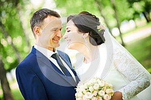 Wedding. bridegroom or fiance portrait with bride in park