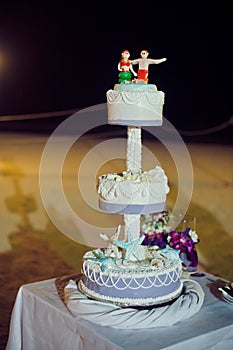 Wedding cake on the beach. Wedding in the tropics concept