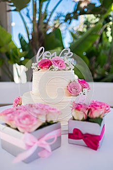 Wedding cake decorated with rose flowers. High quality photo.