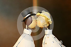 Wedding cake dolls kissing