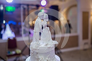 Wedding cake figurines on a wedding cake photo