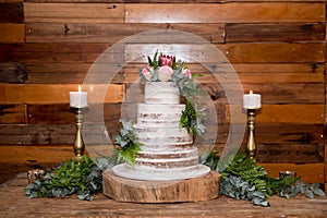 Wedding cake with flowers and candles