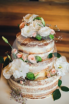 Wedding cake with roses whipped cream